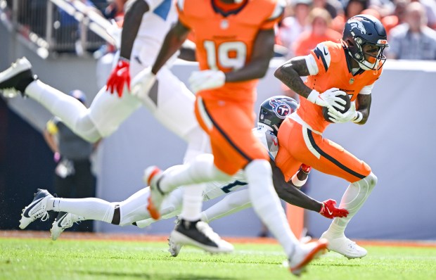 Troy Franklin (11) of the Denver Broncos runs after making...