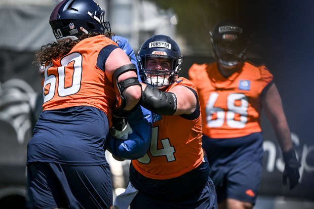 Alex Forsyth (54) of the Denver Broncos works against Luke Wattenberg (60) during OTAs at Broncos Park in Centennial on Wednesday, June 11, 2025. (Photo by AAron Ontiveroz/The Denver Post)