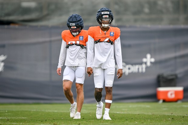 Riley Moss (21) and Pat Surtain II (2) of the Denver Broncos walk during training camp at Broncos Park in Centennial, Colorado on Tuesday, July 29, 2025. (Photo by AAron Ontiveroz/The Denver Post)