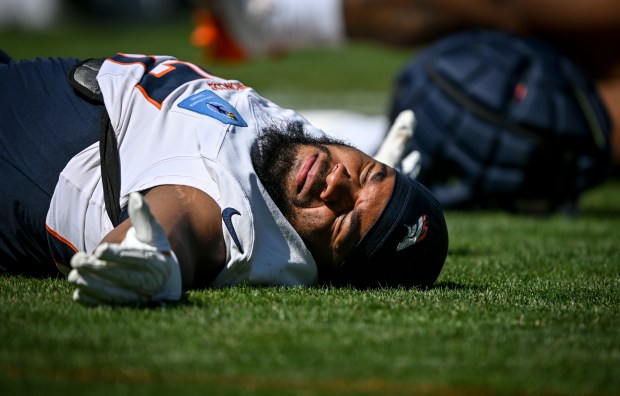 J.K. Dobbins (27) of the Denver Broncos stretches during training camp at Broncos Park in Centennial, Colorado on Tuesday, Aug. 12, 2025. (Photo by AAron Ontiveroz/The Denver Post)