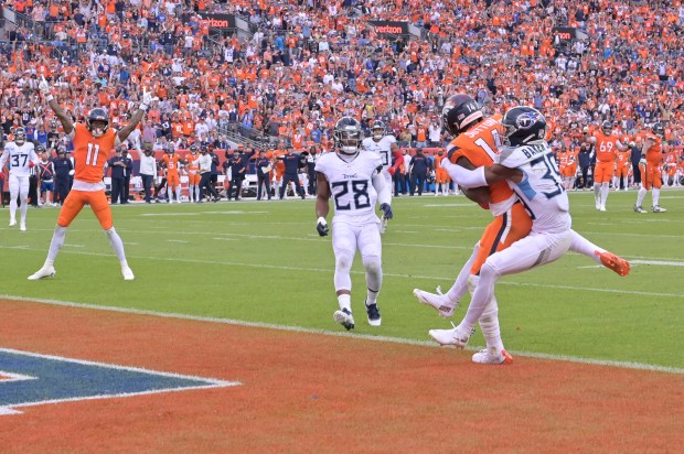 Denver Broncos Courtland Sutton (14) completes the team’s first touchdown...