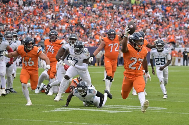Denver Broncos J.K. Dobbins (27) rush for the touchdown in...