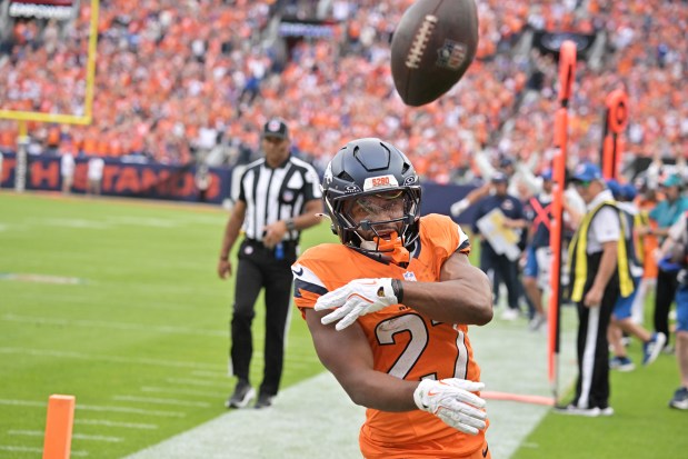 Denver Broncos J.K. Dobbins (27) celebrates his  touchdown in the 4th quarter of the game against Tennessee Titans at Empower Field at Mile High in Denver on Sunday, Sept. 7, 2025. Denver won 20-12. (Photo by Hyoung Chang/The Denver Post)