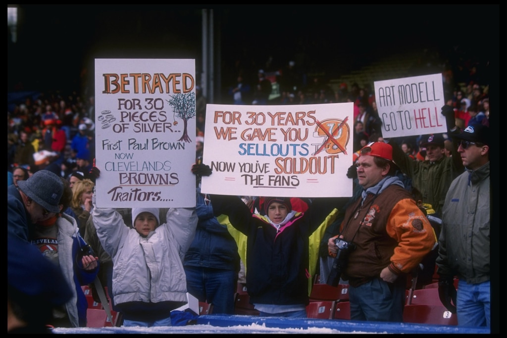 5 Nov 1995:  Cleveland Browns fans with signs look on during a game against the Houston Oilers at Cleveland Stadium in Cleveland, Ohio.  The Oilers won the game, 37-10.