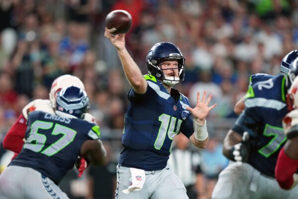 Seattle Seahawks quarterback Sam Darnold (14) throws a pass against the Arizona Cardinals in the third quarter at State Farm Stadium.