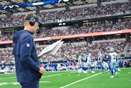 Dallas Cowboys head coach Brian Schottenheimer works on the sidelines during the second half...