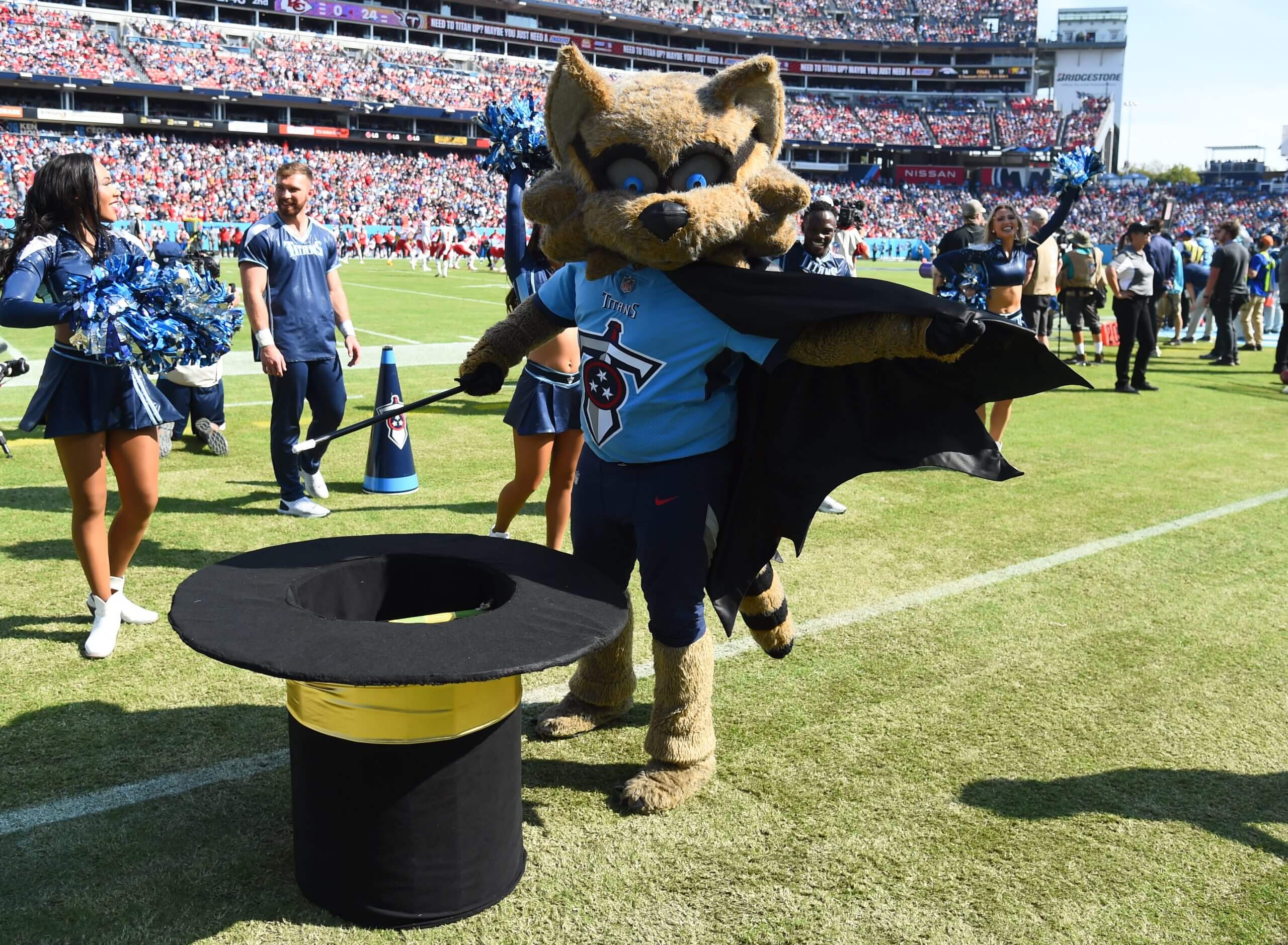 T-Rac, Tennessee's mascot, did a vanishing trick with a Titans cheerleader. (Christopher Hanewinckel / USA TODAY Sports)