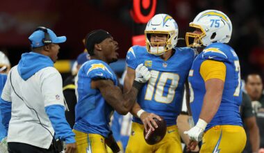 Chargers quarterback Justin Herbert celebrates a win over the Chiefs with his teammates in the 2025 season.