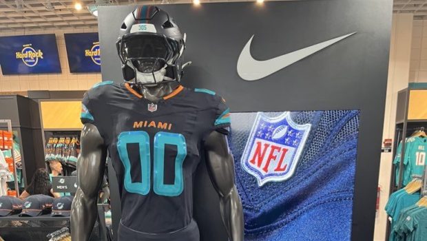 The Miami Dolphins' alternate "Rivalries" uniform for the Monday night game against the New York Jets on Sept. 29, 2025 at Hard Rock Stadium, on display at the team store. (David Furones / Sun Sentinel)
