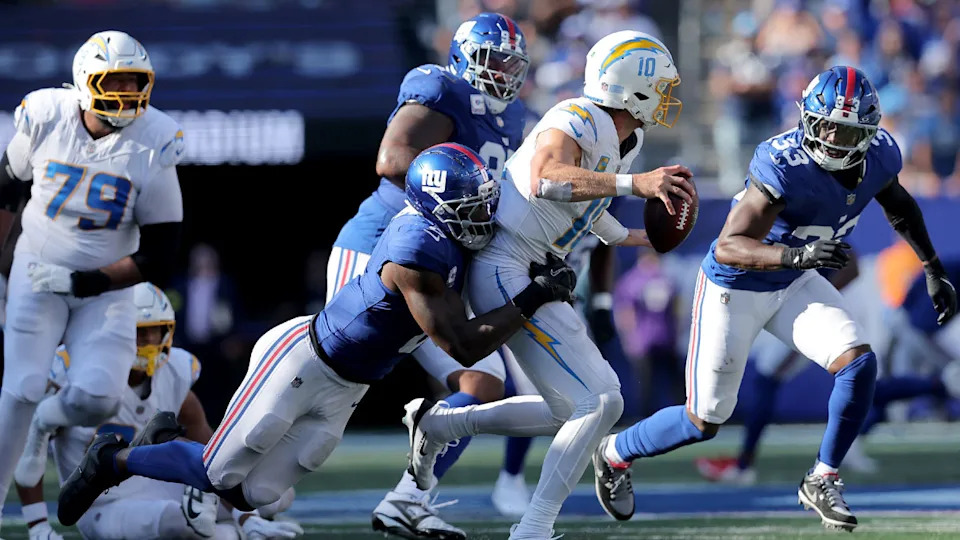 New York Giants linebacker Brian Burns (0) sacks Los Angeles Chargers quarterback Justin Herbert (10) during the fourth quarter at MetLife Stadium. Mandatory Credit: Brad Penner-Imagn