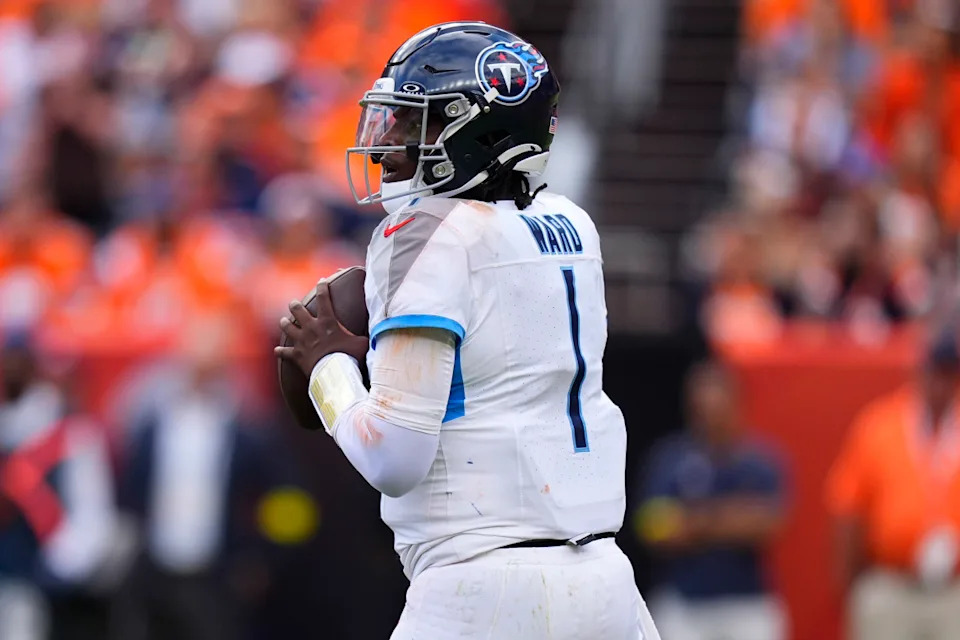 Sep 7, 2025; Denver, Colorado, USA; Tennessee Titans quarterback Cam Ward (1) drops back to pass against the Denver Broncos in the second half at Empower Field at Mile High. Mandatory Credit: Ron Chenoy-Imagn Images