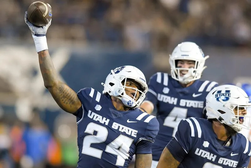 Utah State linebacker William Holmes (24) celebrates recovering a fumble against Air Force in the first half Saturday Sept. 13, 2025, in Logan, Utah. | Eli Lucero/Herald Journal