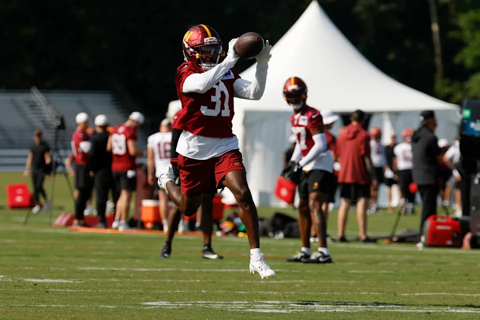 Jul 24, 2025; Ashburn, VA, USA; Washington Commanders cornerback Jonathan Jones (31) catches a ball during practice on day two of training camp at OrthoVirginia Training Center at Commanders Park. Mandatory Credit: Geoff Burke-Imagn Images© Geoff Burke-Imagn Images