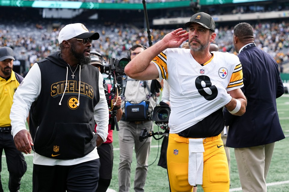Aaron Rodgers and Mike Tomlin after a Steelers game.
