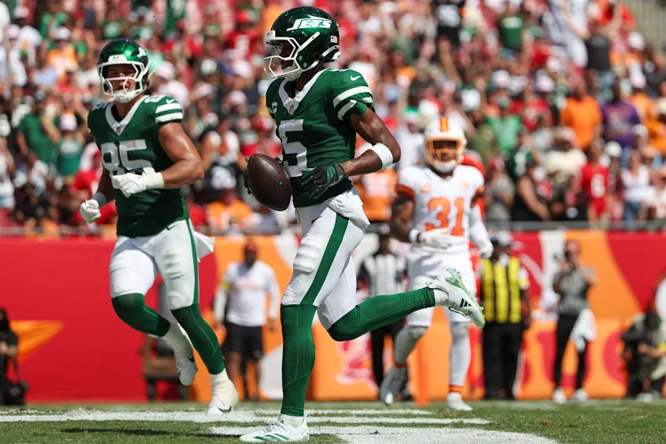 Sep 21, 2025; Tampa, Florida, USA; New York Jets wide receiver Garrett Wilson (5) scores a touchdown against the Tampa Bay Buccaneers in the fourth quarter at Raymond James Stadium. Mandatory Credit: Nathan Ray Seebeck-Imagn Images