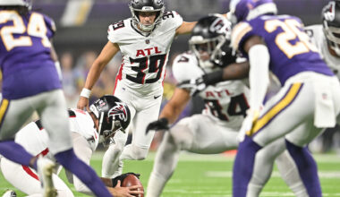 Atlanta Falcons Kicker, #39, John Parker Romo kicking a football during a game.