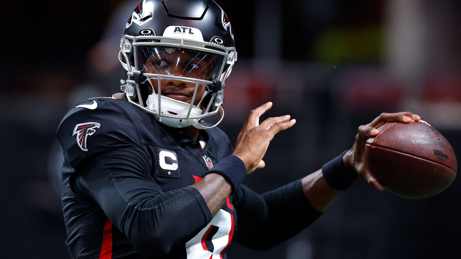 Atlanta Falcons quarterback #9, Michael Penix Jr. holding a football.