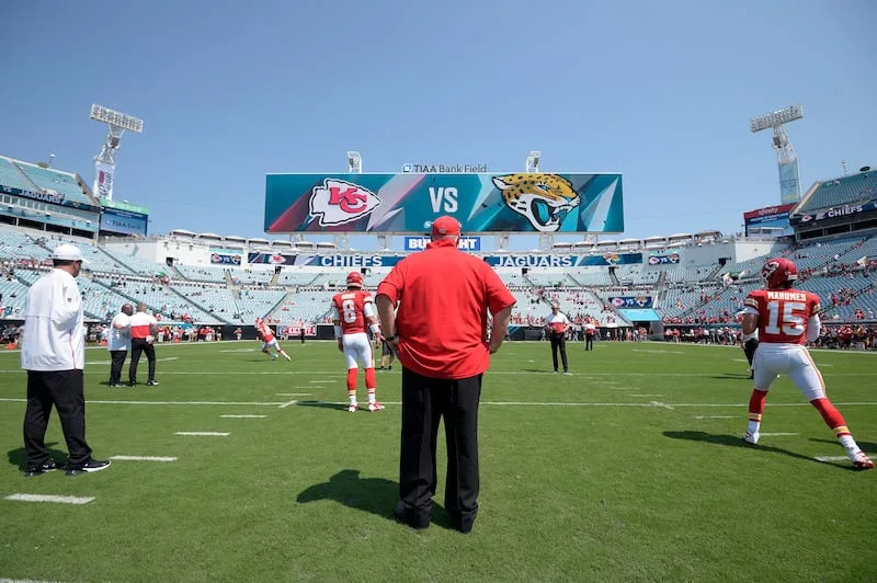 Kansas City Chiefs head coach Andy Reid, center, and assistant Porter Ellett, left, watch warmups before an NFL football game against the Jacksonville Jaguars Sunday, Sept. 8, 2019, in Jacksonville, Fla. | Phelan M. Ebenhack
