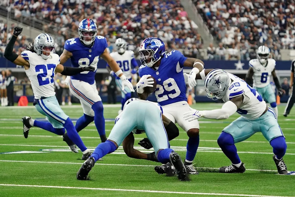 Tyrone Tracy Jr. runs with the ball during the Giants-Cowboys game on Sept. 14, 2025. IMAGN IMAGES via Reuters Connect
