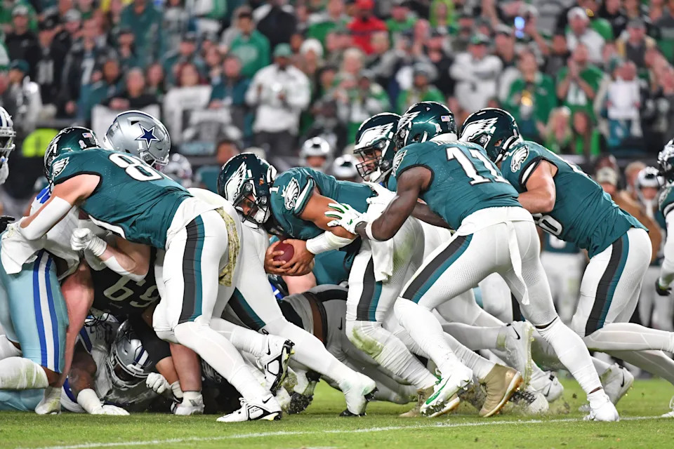 Philadelphia, Pennsylvania, USA; Quarterback Jalen Hurts (1) picks up yardage with a push from wide receiver A.J. Brown (11) and tight end Dallas Goedert (88) against the Dallas Cowboys at Lincoln Financial Field. Mandatory Credit: Eric Hartline-USA TODAY Sports