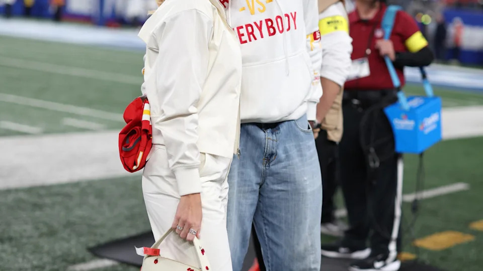 Brittany Mahomes poses with Pat Mahomes Sr before a game between the Kansas City Chiefs and the New York Giants.