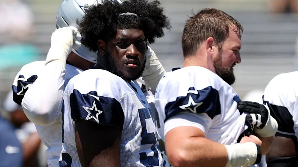 <div>OXNARD, CALIFORNIA - AUGUST 07: Tyler Booker #52 of the Dallas Cowboys looks on during Day 12 of Dallas Cowboys Training Camp at Staybridge Suites Oxnard on August 07, 2025 in Oxnard, California. (Photo by Luke Hales/Getty Images)</div>