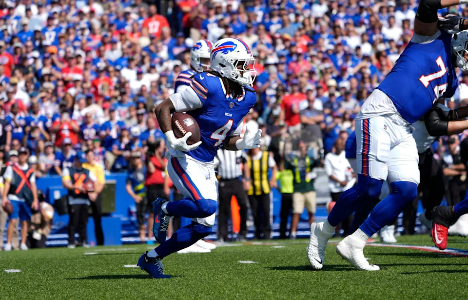 Sep 28, 2025; Orchard Park, New York, USA; Buffalo Bills running back James Cook (4) runs for a gain during the first quarter against the New Orleans Saints at Highmark Stadium. Mandatory Credit: Gregory Fisher-Imagn Images