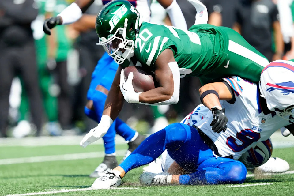 New York Jets running back Breece Hall (20) dives for another few yards, Sunday, September 14, 2025, in East Rutherford.