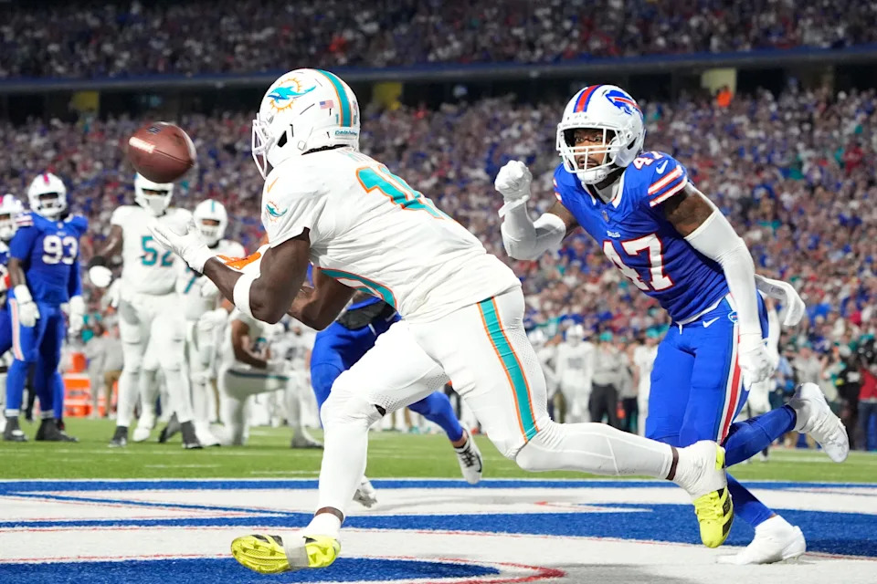 Sep 18, 2025; Orchard Park, New York, USA; Miami Dolphins wide receiver Tyreek Hill (10) makes a catch to score a touchdown against Buffalo Bills cornerback Christian Benford (47) in the fourth quarter at Highmark Stadium. Mandatory Credit: Gregory Fisher-Imagn Images