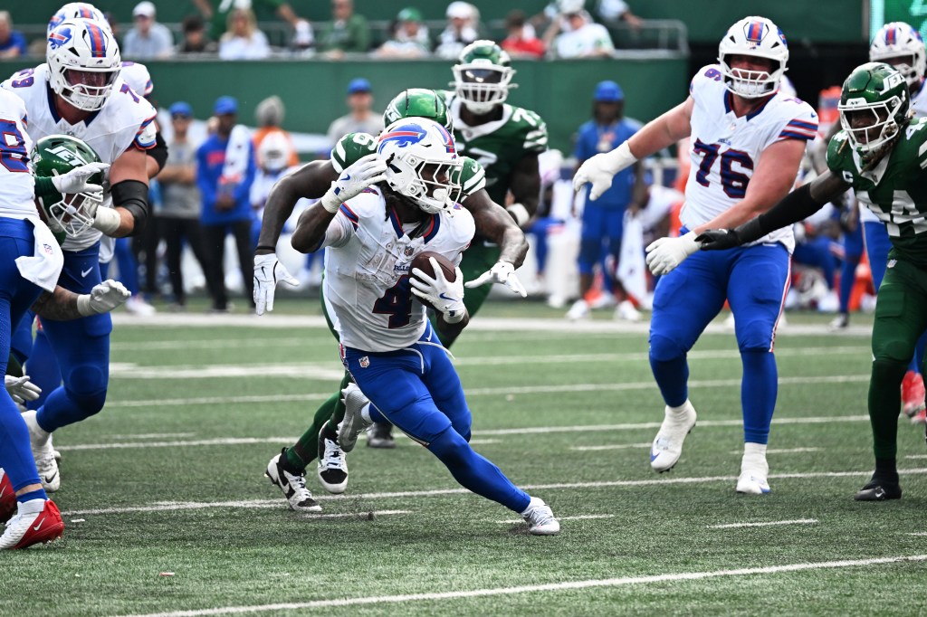 James Cook runs with the ball during the Bills-Jets game on Sept. 14, 2025. 