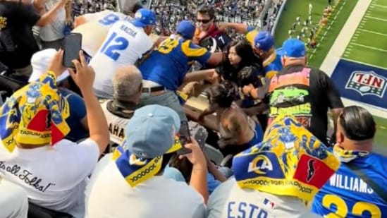 Video from SoFi Stadium showed Rams and Texans fans fighting. A woman was punched and bloodied before security escorted the Texans fans out.(@Brian.bowie43/TikTok)