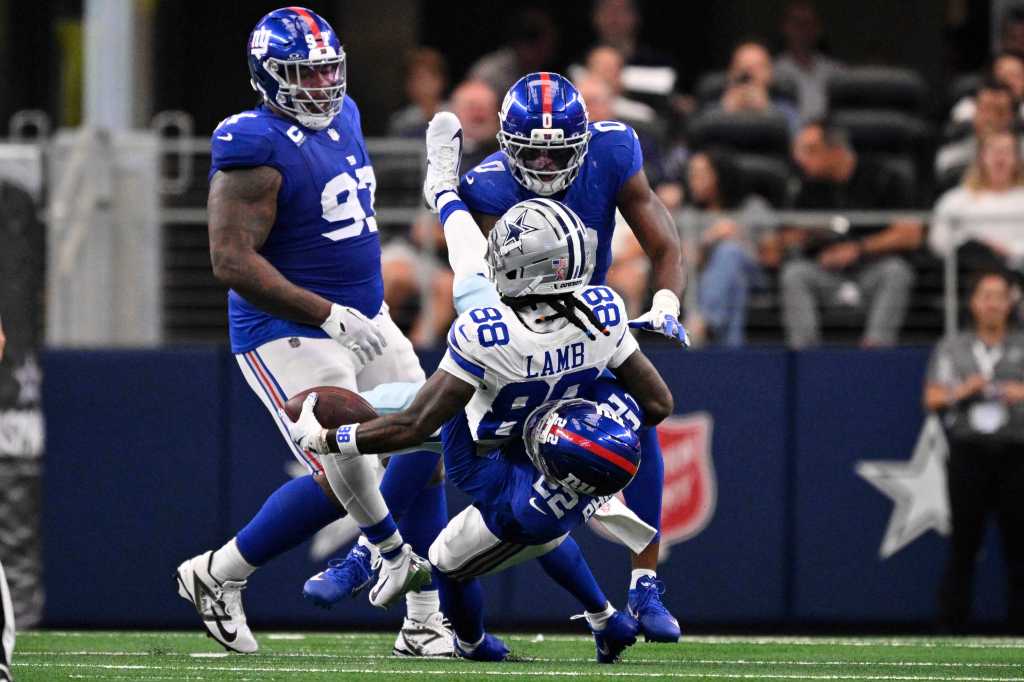 Dru Phillips (No. 22) slams CeeDee Lamb to the ground, drawing a flag during the Giants-Cowboys game on Sept. 15, 2025. 