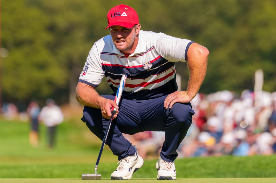 Bryson DeChambeau of Team USA checks his line on hole 12 during the Ryder Cup Singles Matches.
