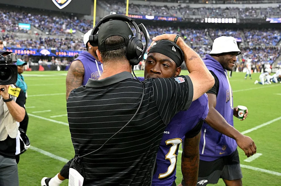 LaJohntay Wester of the Baltimore Ravens celebrates with head coach John Harbaugh after returning a kick for a touchdown in the first quarter against the Indianapolis Colts during the NFL Preseason 2025 game at M&T Bank Stadium on August 07, 2025 in Baltimore.