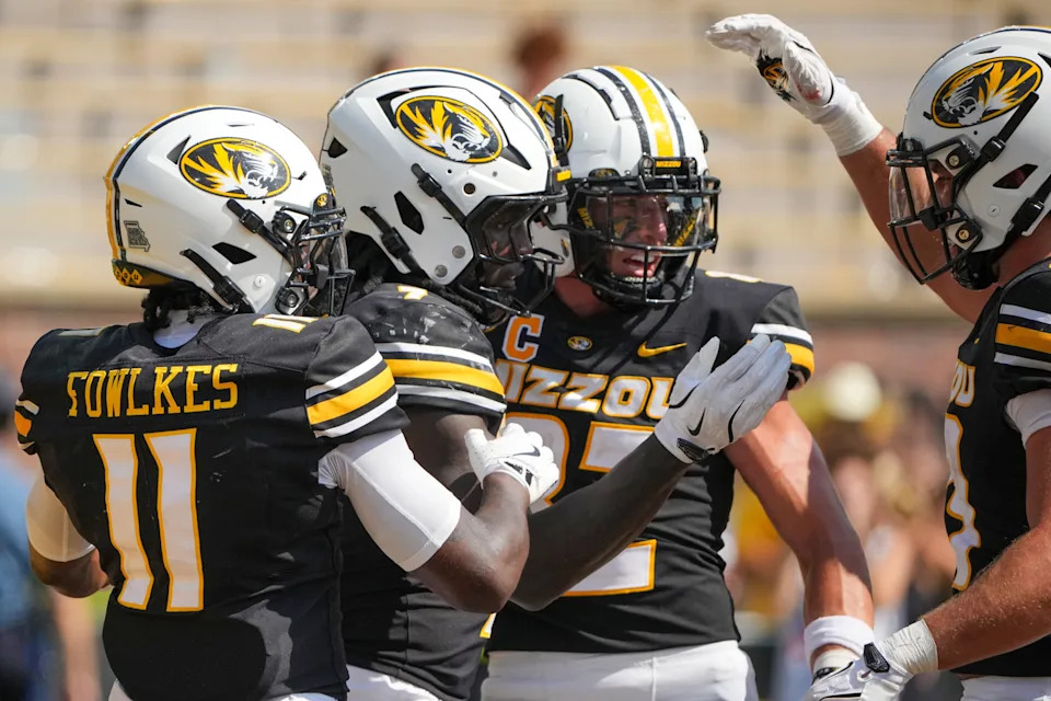 Sep 13, 2025; Columbia, Missouri, USA; Missouri Tigers running back Marquise Davis (7) celebrates with team mates after scoring against the Louisiana-Lafayette Ragin Cajuns during the second half of the game at Faurot Field at Memorial Stadium. Mandatory Credit: Denny Medley-Imagn Images
