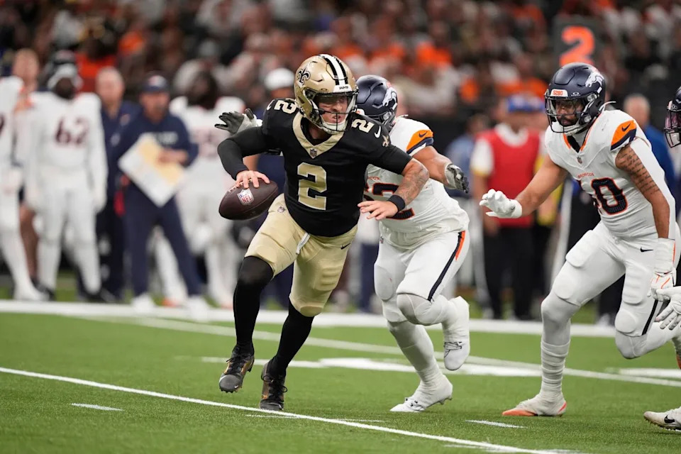 New Orleans Saints quarterback Spencer Rattler scrambles during a preseason game against the Denver Broncos on Aug. 23.