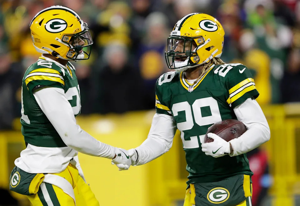 Green Bay Packers safety Xavier McKinney (29) celebrates with cornerback Carrington Valentine (24) after intercepting a pass against San Francisco 49ers quarterback Brandon Allen during their game on Sunday, Nov. 24, 2024, at Lambeau Field in Green Bay, Wisconsin. It was McKinney's seventh interception of the season.