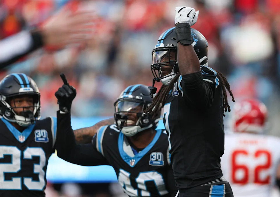Carolina Panthers outside linebacker Jadeveon Clowney, right, celebrates with teammates after a quarterback sack during a 2024 game against the Kansas City Chiefs at Bank of America Stadium