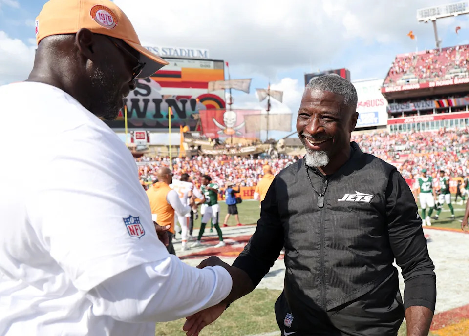 Sep 21, 2025; Tampa, Florida, USA; Tampa Bay Buccaneers head coach Todd Bowles and New York Jets head coach Aaron Glenn greet after the game at Raymond James Stadium. Mandatory Credit: Kim Klement Neitzel-Imagn Images