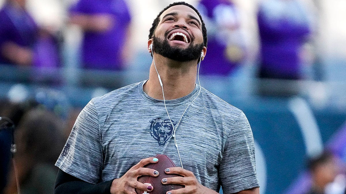 Caleb Williams smiles on field