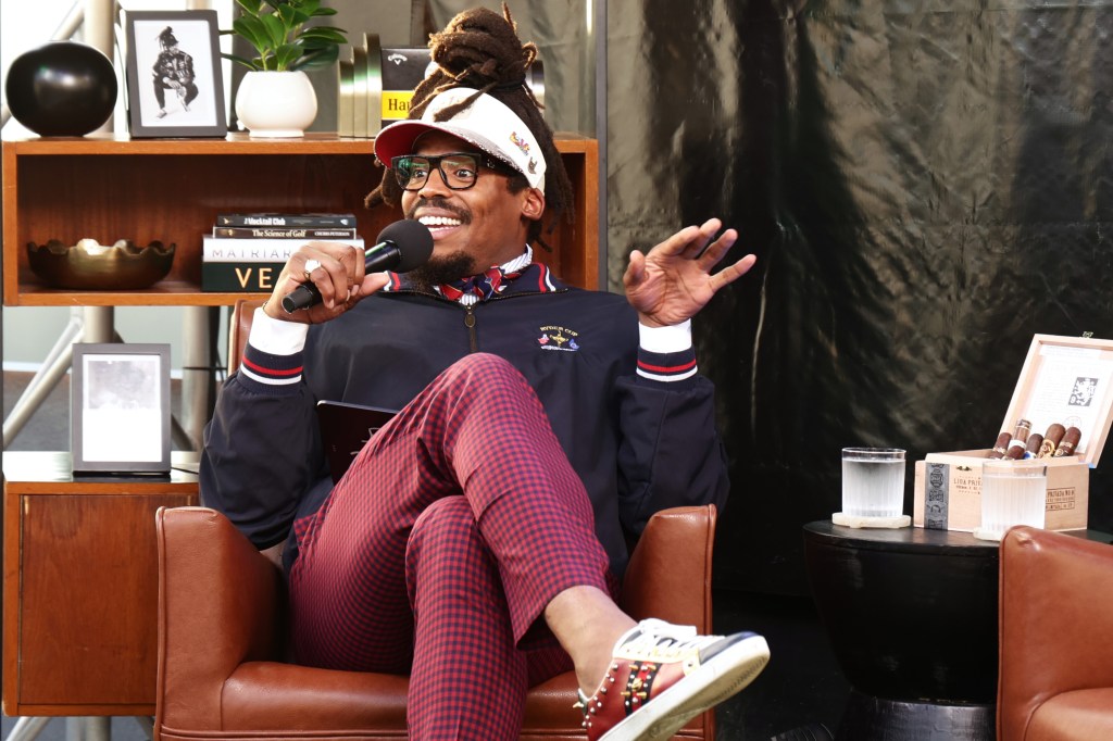 Cam Newton speaking at the Happy Gilmore 2 Presents: Disruptors Redefining The Game event.