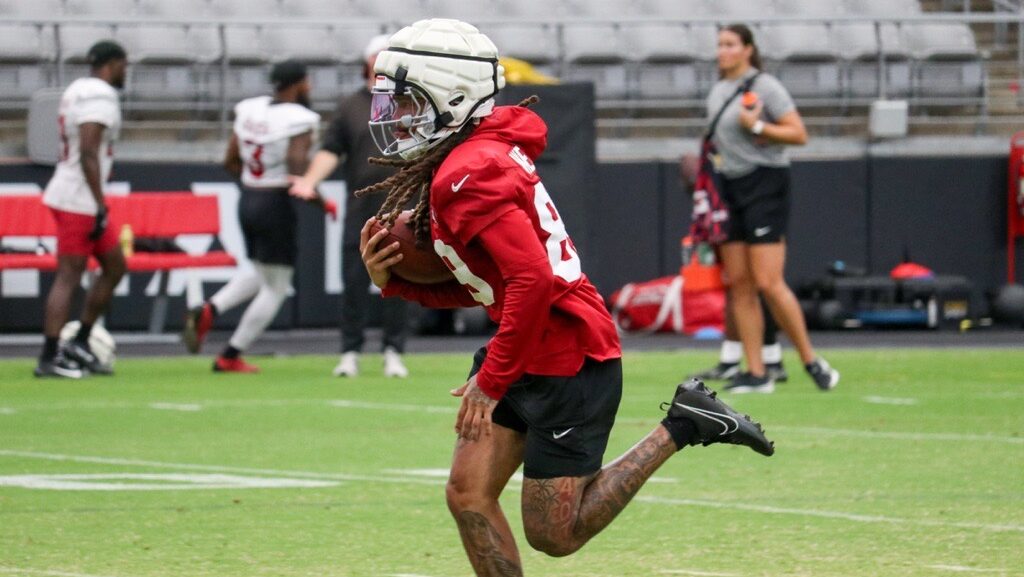Xavier Weaver takes back a return during Cardinals practice...