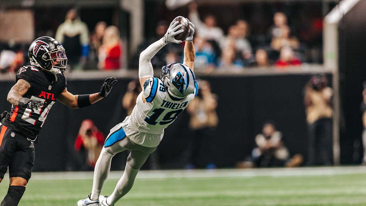 Jalen Coker and Adam Thielen with friendly competition