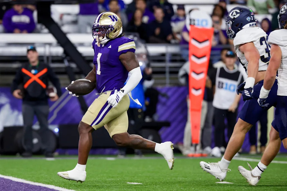 Sep 6, 2025; Seattle, Washington, USA; Washington Huskies running back Jonah Coleman (1) rushes for a touchdown against the UC Davis Aggies during the first quarter at Husky Stadium. Mandatory Credit: Joe Nicholson-Imagn Images