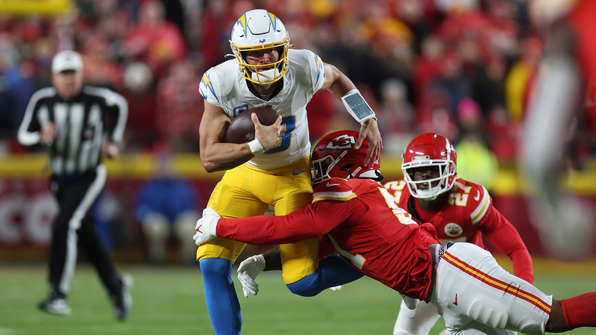 Justin Herbert tackled