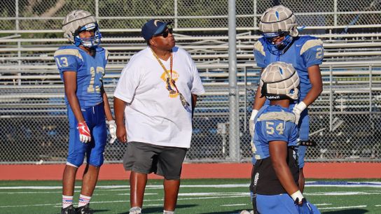 Coach Garrett at practice having some fun with his players during practice.
