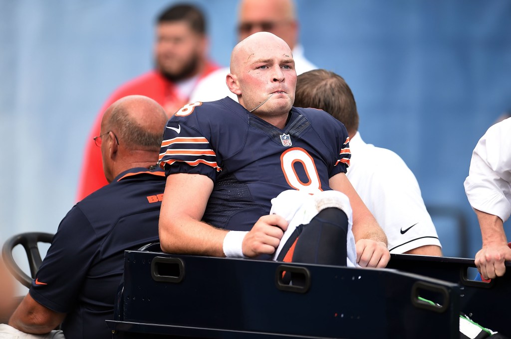 Injured Chicago Bears player being carted off the field.