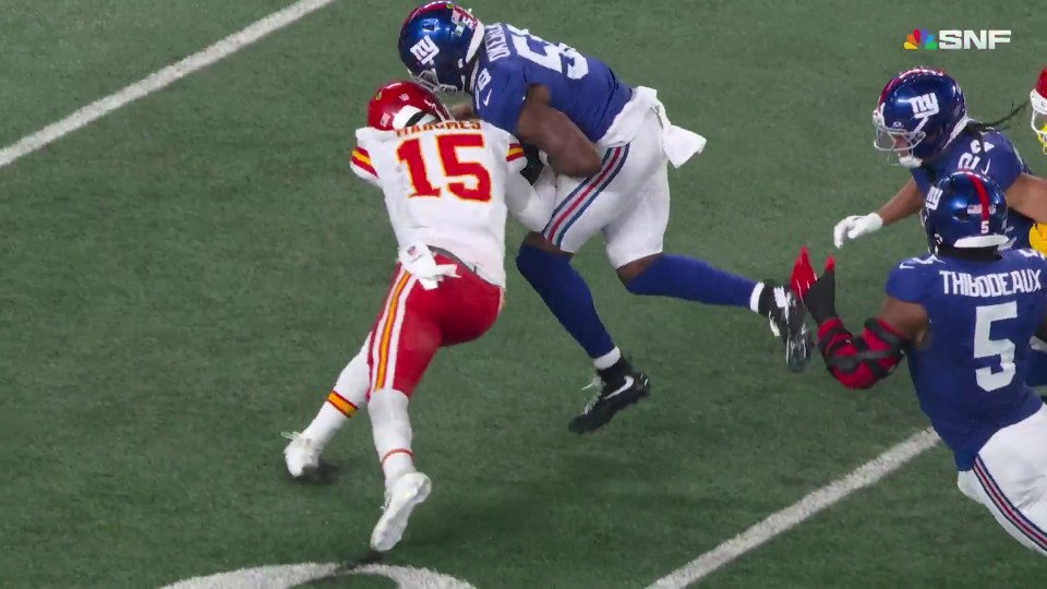 Kansas City Chiefs quarterback Patrick Mahomes is tackled by a New York Giants player.