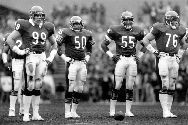 With a defiant hands-on-hips posture, Bear defenders Dan Hampton, from left, Mike Singletary, Otis Wilson and Steve McMichael wait for more action against the Redskins in 1984. Coach Bill Walsh of the 49ers called the Bears "the team to beat next year." (Bob Langer/Chicago Tribune)