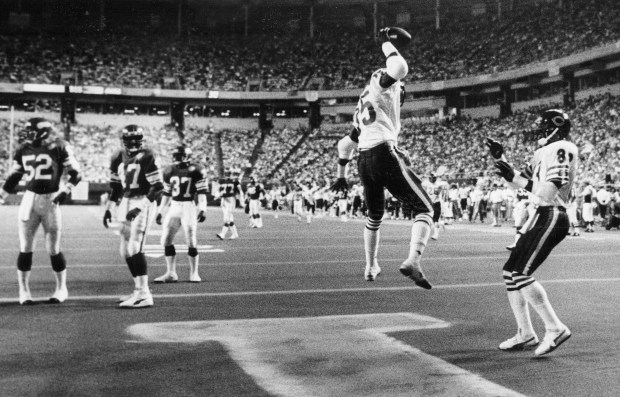 Dennis McKinnon, second from right, celebrates the first of his two scoring catches against the Vikings, a 25-yarder that put the Bears ahead to stay in their 33-24 comeback victory on Sept. 19, 1985, in Minneapolis. Willie Gault (83), right, celebrates with McKinnon. (Charles Cheney/Chicago Tribune)